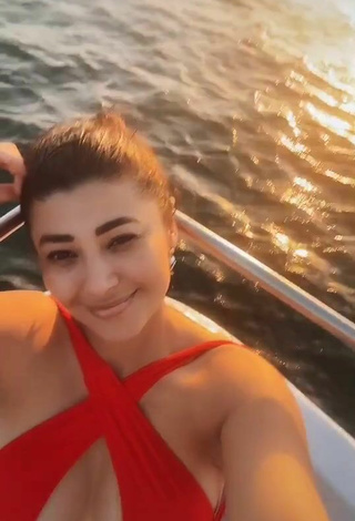 2. Hot Milagro Flores Shows Cleavage in Red Swimsuit on a Boat