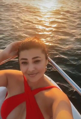 5. Hot Milagro Flores Shows Cleavage in Red Swimsuit on a Boat