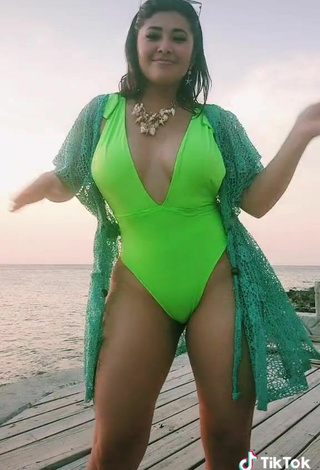 4. Sexy Milagro Flores Shows Cleavage in Green Swimsuit