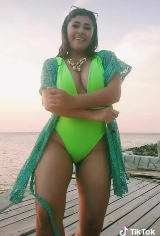 5. Sexy Milagro Flores Shows Cleavage in Green Swimsuit
