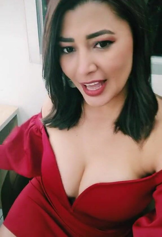 6. Cute Milagro Flores Shows Cleavage in Red Dress