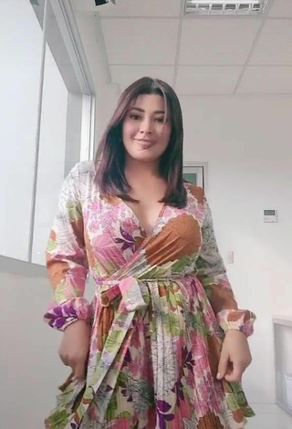 Sexy Milagro Flores Shows Cleavage in Floral Dress