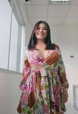 2. Sexy Milagro Flores Shows Cleavage in Floral Dress
