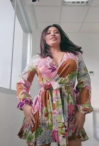 6. Sexy Milagro Flores Shows Cleavage in Floral Dress