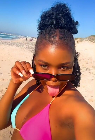 3. Hot mpho pink Shows Cleavage in Bikini Top at the Beach