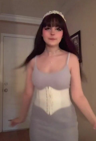 Sweetie Kylie Shows Cleavage in White Corset