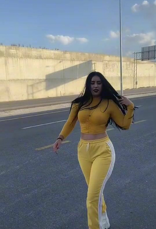 1. Sexy Seherkoçaker in Yellow Crop Top in a Street