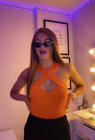 Sexy Sophie Aspin Shows Cleavage in Orange Top