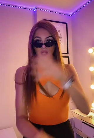 3. Sexy Sophie Aspin Shows Cleavage in Orange Top