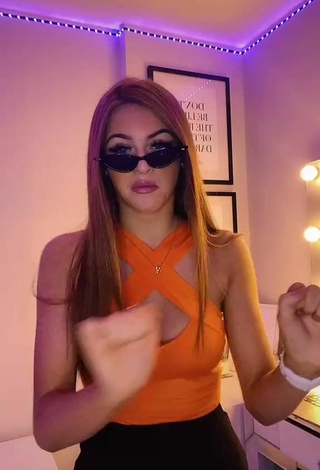 4. Sexy Sophie Aspin Shows Cleavage in Orange Top