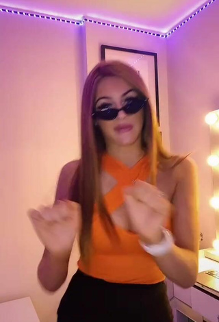 5. Sexy Sophie Aspin Shows Cleavage in Orange Top