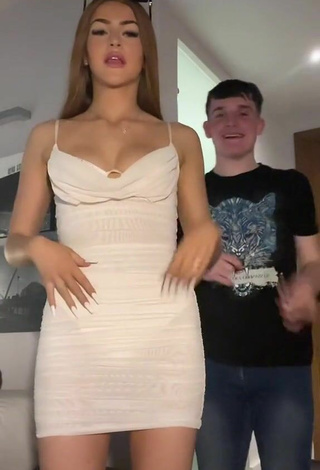5. Sexy Sophie Aspin Shows Cleavage in White Dress