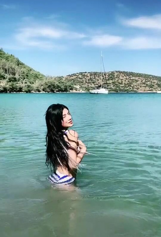 3. Sexy Sude Naz Bulut Shows Cleavage in Striped Bikini in the Sea