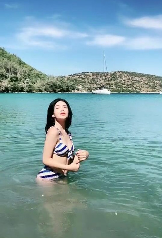 4. Sexy Sude Naz Bulut Shows Cleavage in Striped Bikini in the Sea