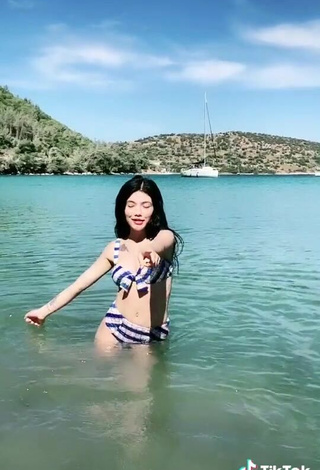 5. Sexy Sude Naz Bulut Shows Cleavage in Striped Bikini in the Sea