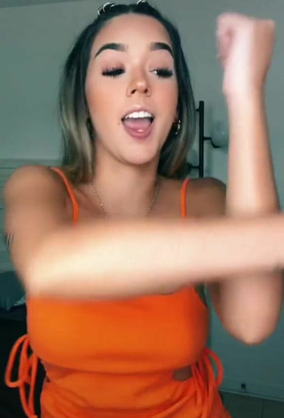 4. Sexy Susana Torres Shows Cleavage in Orange Dress