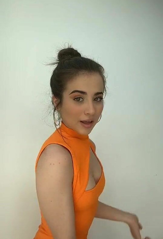 1. Beautiful Valeria Monerri Shows Cleavage in Sexy Orange Dress