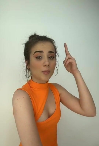 5. Beautiful Valeria Monerri Shows Cleavage in Sexy Orange Dress