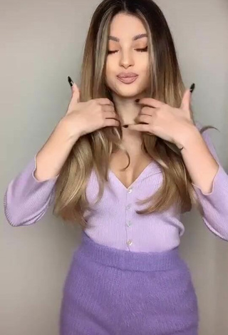 Sexy Valerie Lungu Shows Cleavage in Violet Top