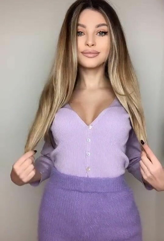 2. Sexy Valerie Lungu Shows Cleavage in Violet Top