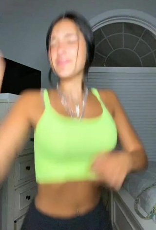 2. Erotic Taylor Mackenzie Shows Cleavage in Lime Green Sport Bra