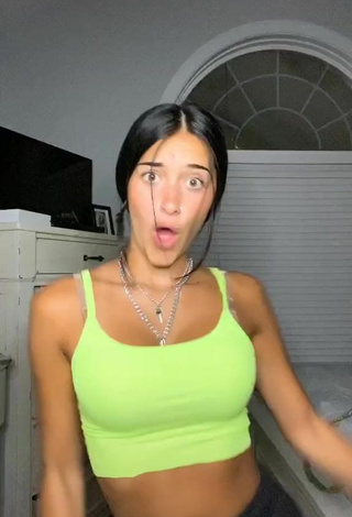 3. Erotic Taylor Mackenzie Shows Cleavage in Lime Green Sport Bra