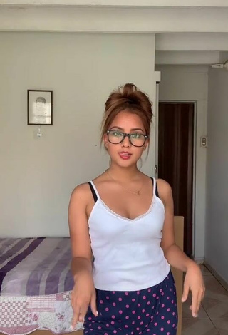 Cute Yess Shows Cleavage in White Top