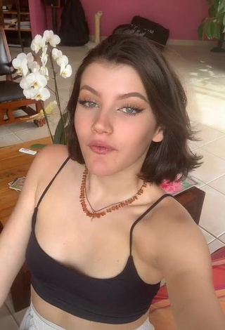 Sexy Bleue Shows Cleavage in Black Crop Top