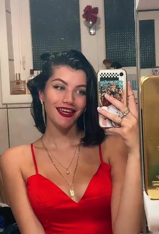 2. Sexy Bleue Shows Cleavage in Red Dress