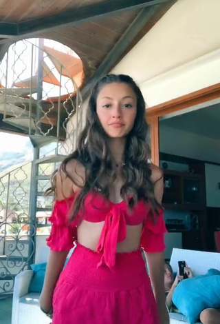 Cute Brunella Cacciuni Shows Cleavage in Pink Crop Top