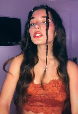 Sexy Alejandra Olivera Shows Cleavage in Orange Tube Top
