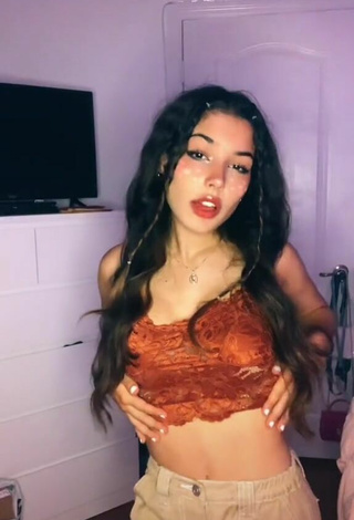 3. Sexy Alejandra Olivera Shows Cleavage in Orange Tube Top