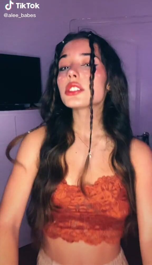 Sexy Alejandra Olivera Shows Cleavage in Orange Tube Top | sexyfilter.com