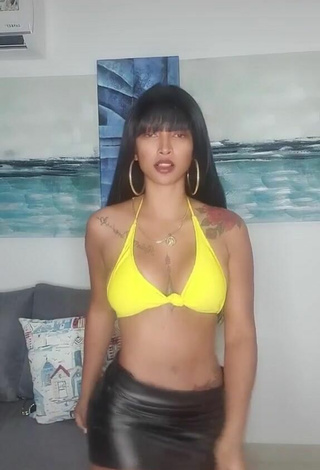 1. Sexy Aliany García Shows Cleavage in Yellow Bikini Top