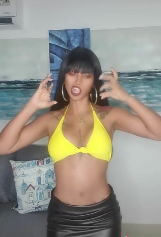 6. Sexy Aliany García Shows Cleavage in Yellow Bikini Top