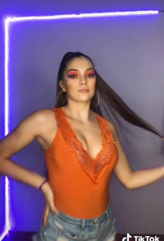 6. Sexy Azul Granton Shows Cleavage in Orange Top