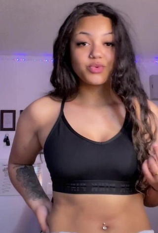 4. Sexy Dellecia Ann Marie Ethier Shows Cleavage in Black Crop Top