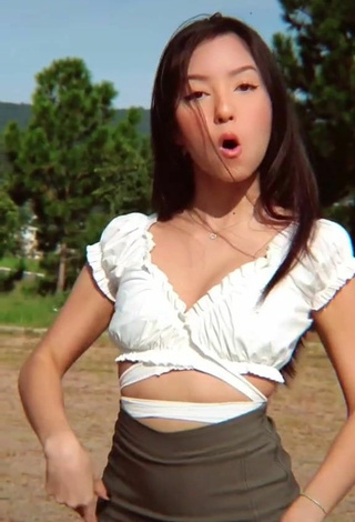 4. Sexy Gabriela Mayumi Shows Cleavage in White Crop Top