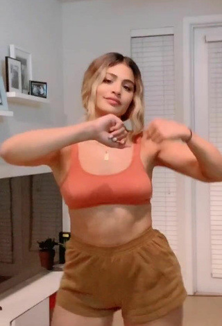 2. Wonderful Gabriela Bandy Shows Cleavage in Orange Crop Top and Bouncing Breasts