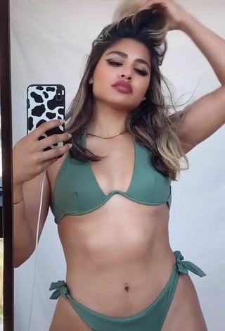 2. Erotic Gabriela Bandy Shows Cleavage in Green Bikini