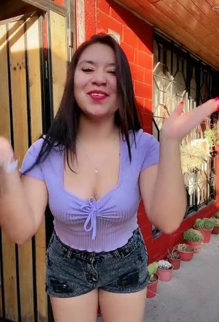6. Cute Christel Quiroz Shows Cleavage in Purple Crop Top