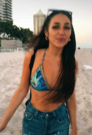 2. Hot Iris Shows Cleavage in Bikini Top at the Beach