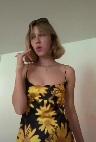 Sexy Claire Drake Shows Cleavage in Floral Dress