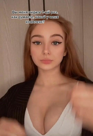 Sexy kor.liz Shows Cleavage in White Crop Top