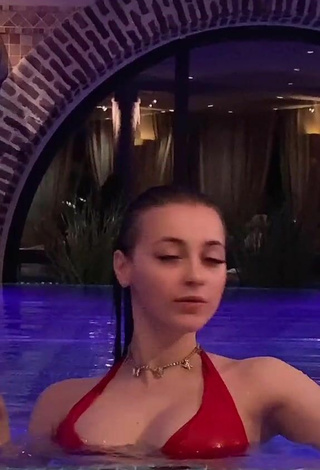 2. Sexy Irina Lazutchikova Shows Cleavage in Red Bikini at the Pool