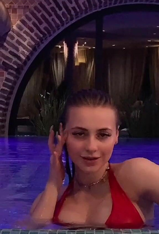 3. Sexy Irina Lazutchikova Shows Cleavage in Red Bikini at the Pool