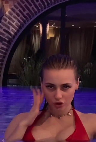 4. Sexy Irina Lazutchikova Shows Cleavage in Red Bikini at the Pool
