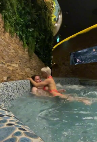 5. Hot Lil Masti Shows Cleavage in Orange Bikini at the Swimming Pool