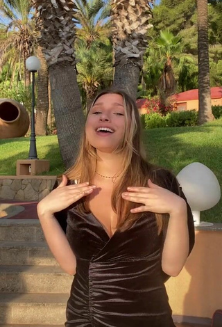 5. Sexy Lucy Lacht Shows Cleavage in Black Dress