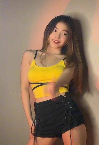 4. Cute Madelaine Red Shows Cleavage in Yellow Crop Top